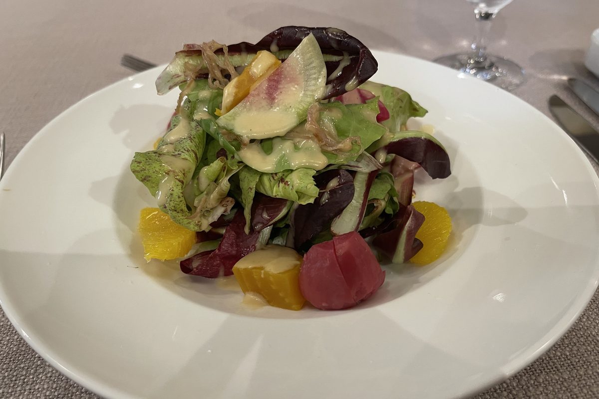 Beet and orange salad on a white plate